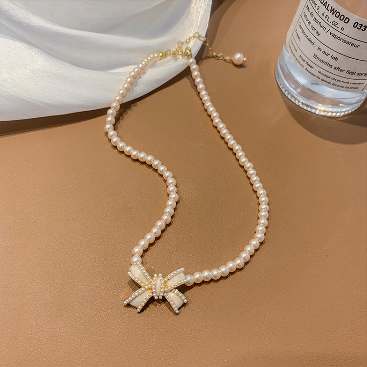 French light luxury retro pearl bow short necklace female 2021 niche design clavicle chain gentle 
