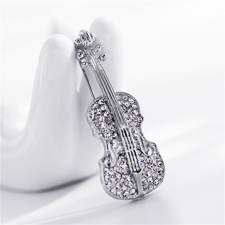 Europe and the United States selling fashion women's pin punk personality crystal rhinos violin brooch coat sweater accessories ?